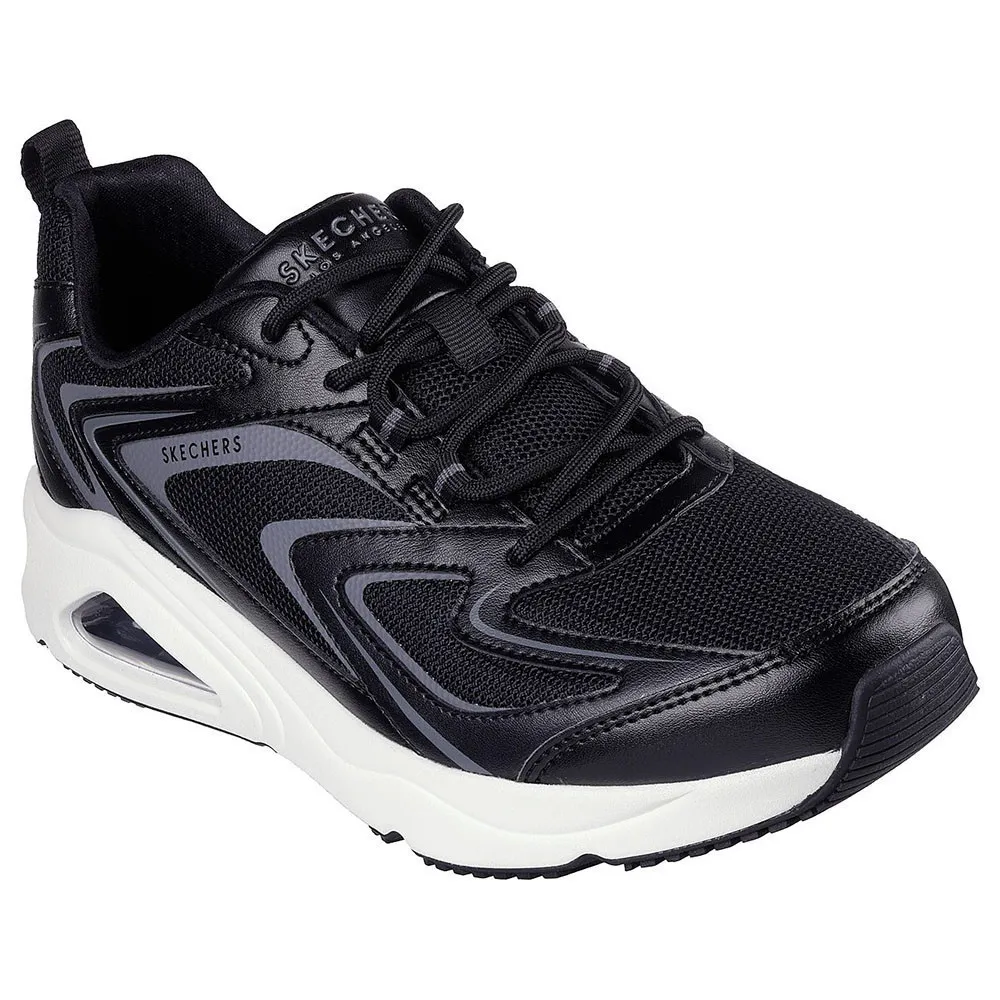 รองเท้า Skechers Tres-Air Uno 183082 สีดำสลับเทาในมุมเฉียง แสดงรายละเอียดของส่วนบนที่เป็นตาข่ายและหนัง พร้อมพื้นรองเท้าสีขาว