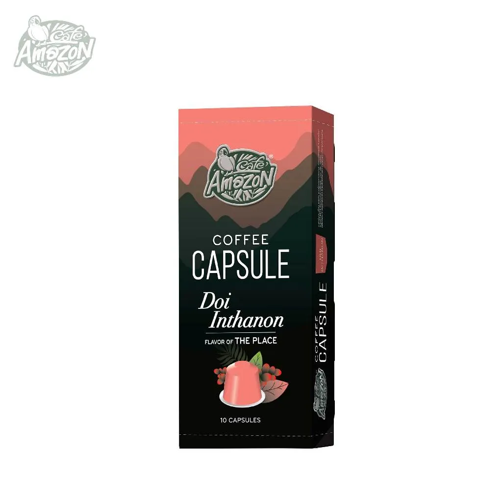 กล่องแคปซูล Doi Inthanon สีส้มอมชมพู แสดงภาพผลเชอร์รี่กาแฟบนต้น