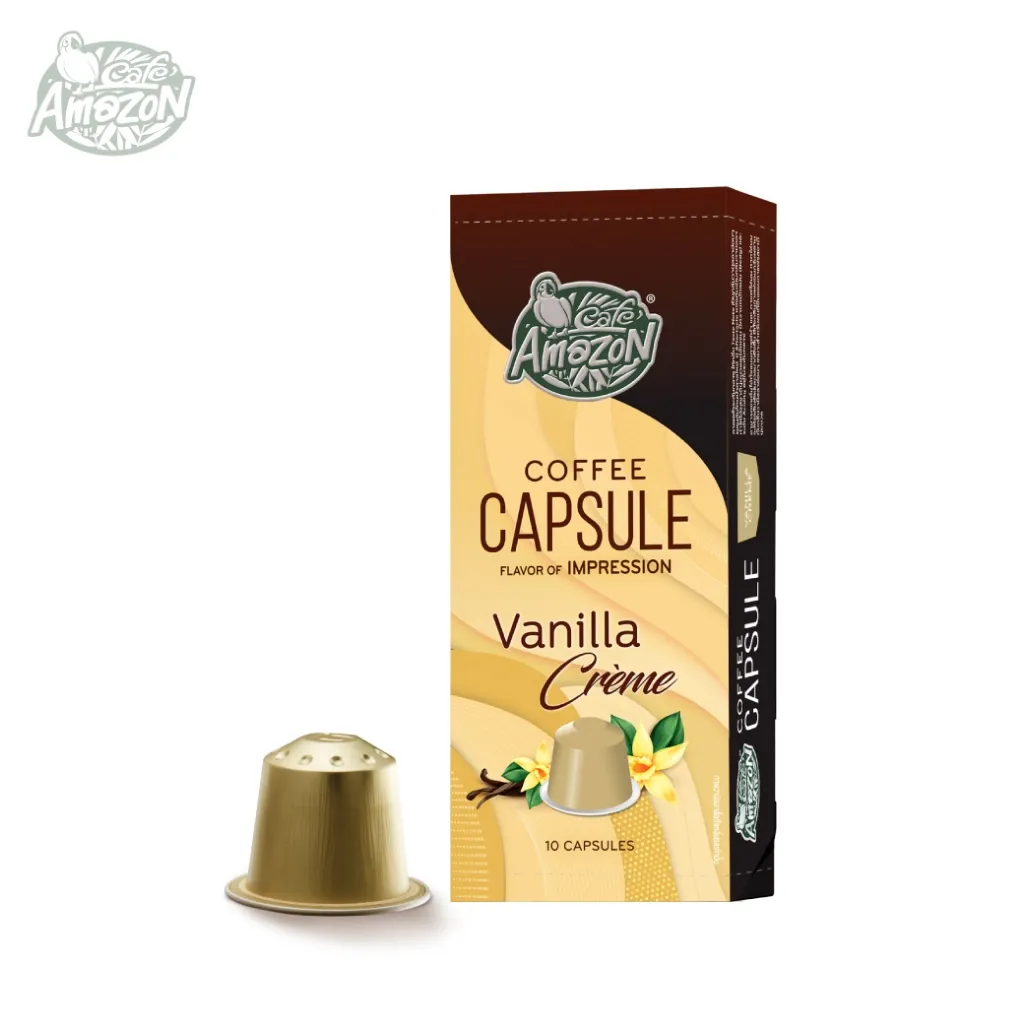 กล่องแคปซูล Vanilla Creme สีครีม แสดงภาพฝักวานิลลาและดอกไม้