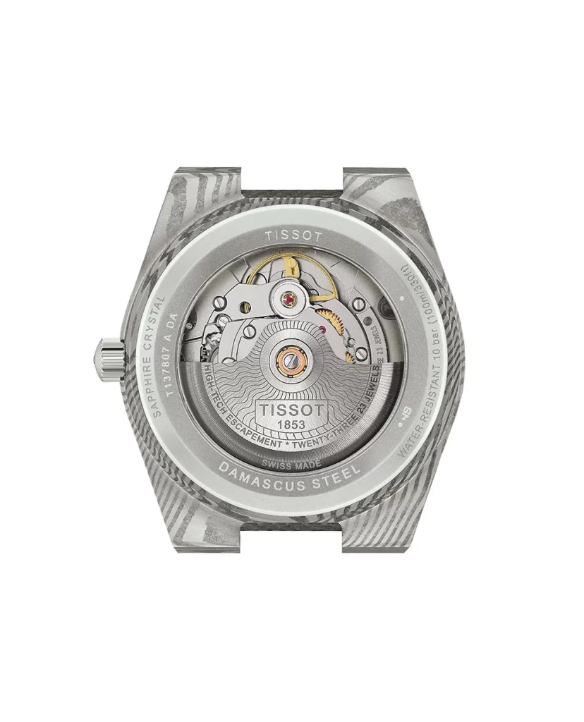 ฝาหลังโชว์เครื่องออโต้ ของ Tissot PRX Damascus 38mm เห็นโรเตอร์และกลไกชัดเจน