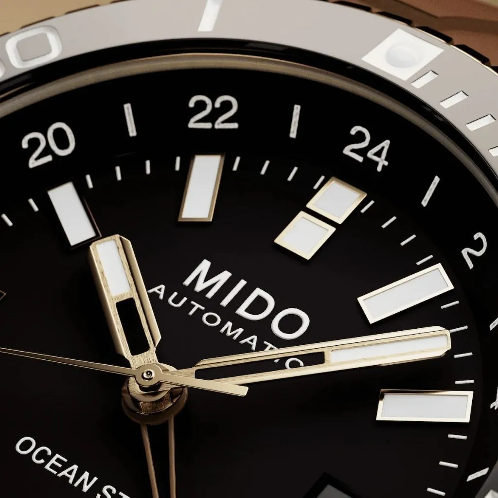 MIDO Ocean Star GMT M0266293729100 ซูมหน้าปัดดำ เข็มสีทองและหลักเรืองแสง พร้อมสเกล 24 ชั่วโมง